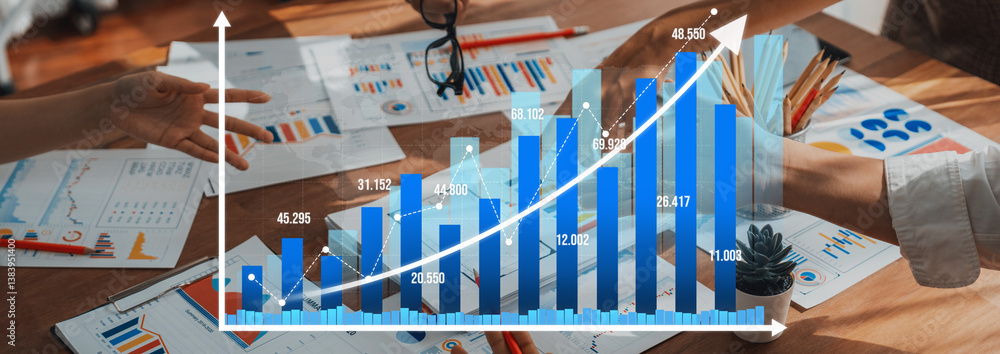 Leinwandbilder a dynamic business team collaborates to analyze growth charts and data visuals in a modern office se