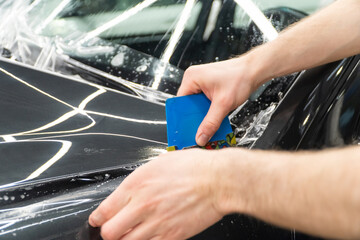 The process of installing PPF, armored film on the car. PPF is a polyurethane, protective film that...