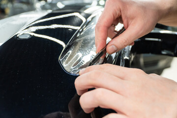 The process of installing PPF, armored film on the car. PPF is a polyurethane, protective film that...