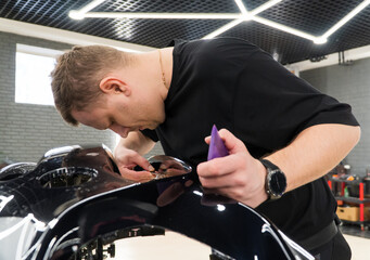 The process of installing PPF, armored film on the car. PPF is a polyurethane, protective film that...