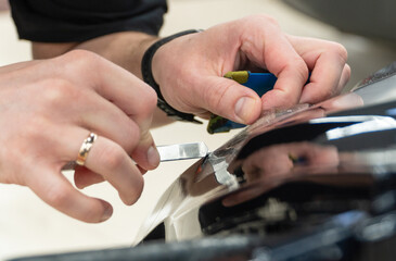 The process of installing PPF, armored film on the car. PPF is a polyurethane, protective film that...
