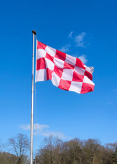 Flag of the Dutch province of North-Brabant is waving in the wind