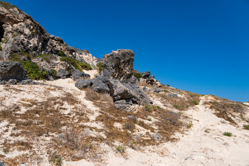 Sharp rocks on a sand hill on the Greek island of Crete