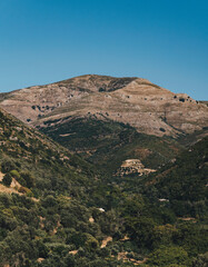 Mountainous landscape covered with sparse flora in Mediterranean region