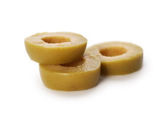 Slices of delicious marinated green olive isolated on white