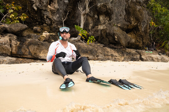 Ecotourist Enjoys Pristine Beach in Raja Ampat Archipelago