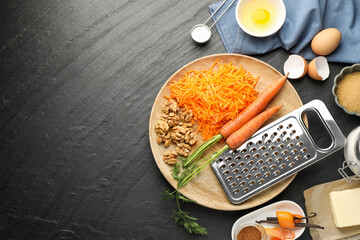 Different ingredients for making carrot cake on black table, flat lay. Space for text
