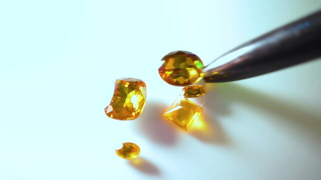 Gemstones on a white table in multicolor illumination