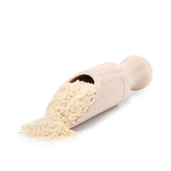 Superfood product. Sesame seeds powder in scoop isolated on white