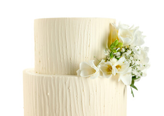 Delicious wedding cake with floral decor isolated on white