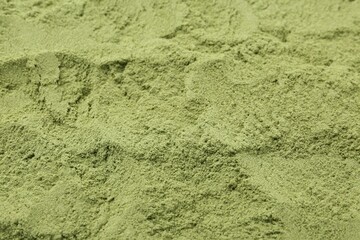 Superfood. Wheat grass powder as background, closeup