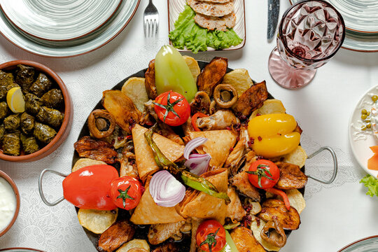 Sac or saj - Azerbaijani dish roasted chicken, lamb or beef, vegetables and mushrooms