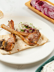 Lamb chops kebab on lavash close up