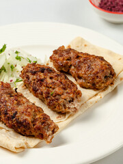 Lula kebab on lavash close up