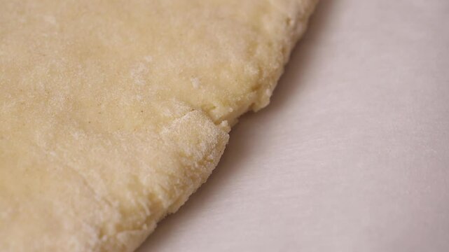 Dough rising gradually on pristine white surface, revealing intricate yeast-driven biological transformation during bread preparation, showcasing organic fermentation process