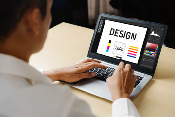 Graphic designer software for modern design of web page and commercial ads showing on the computer screen