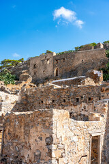 Ancient Ruins: Crumbled Fortress with Greenery