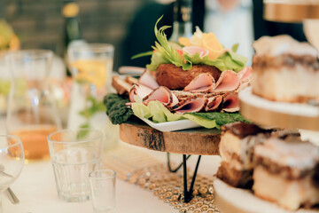Close-up of rustic finger food at event – savory snacks served at a country-style celebration, perfect for casual gatherings