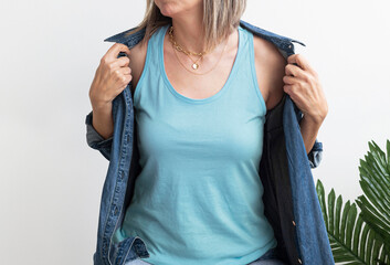 Blank Blue Tank Top Shirt Mock up. Woman wear empty tank top shirt mock up. Girl in sleeveless...