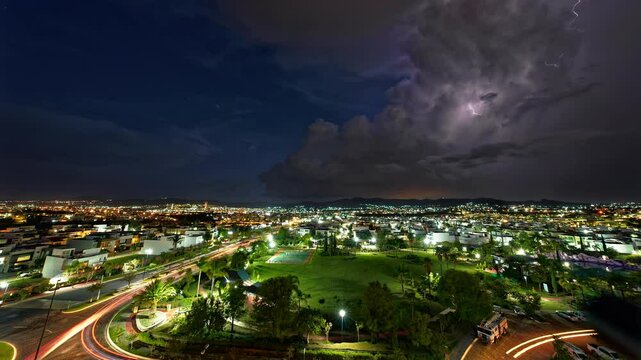 Horizontal landscaped video of Puebla cityscape with purple lightnings during nighttime