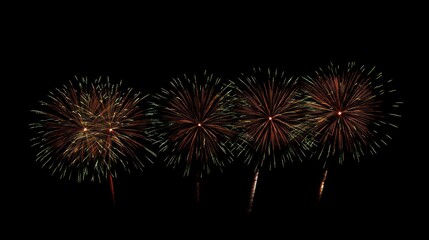 Four red and green fireworks exploding against a black background.