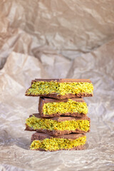 Luxury trending Dubai chocolate with creamy pistachio filling and crispy kataifi dough. Middle...