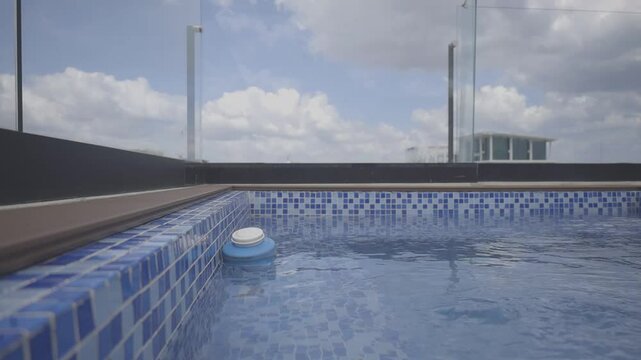 shot of a jacuzzi in an apartment with city background on sunny day with beautiful blue sky, Canon eos r, 8bits color, C-log HD