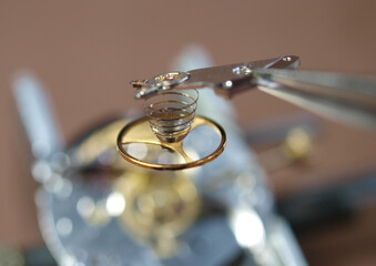 vintage mechanical watch under repair, close up detail