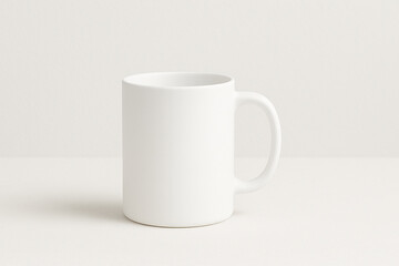 Fototapeta premium Minimalist white ceramic mug mockup on a neutral background.