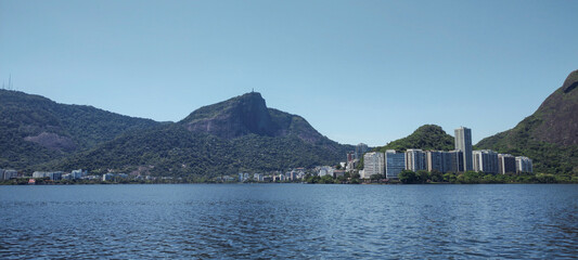 Rio de Janeiro skyline landscape city urban lagoon forest stone rock mountain hill vegetation nature green tree bird heron sky blue water park garden vacation beautiful path wood land asphalt deck