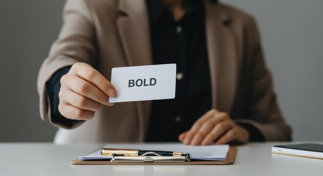Person holding card with word "BOLD", concept of confidence and assertiveness