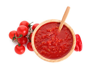 Bowl with tasty tomato sauce and fresh vegetables on white background
