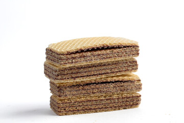 stack of sweet chocolate wafer snacks isolated on white background