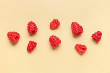 Fresh raspberries on yellow background