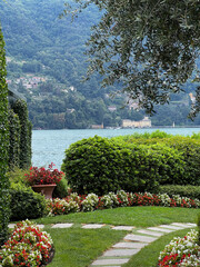 A Serene Lake View Surrounded by a Lush Garden Full of Vibrant and Beautiful Flowers