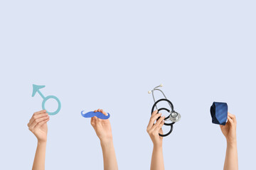 Female hands with male sign, mustache, stethoscope and tie on white background. Prostate cancer...