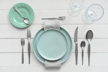 Beautiful table setting on white background. Top view