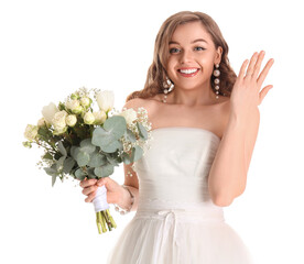 Beautiful bride in wedding dress with flowers on white background