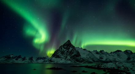 Vibrant green aurora borealis dances over a dramatic, snow-capped mountain range at night.