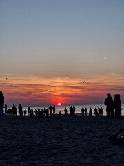 Relaxing at the beach, admiring the sunset