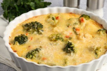 Delicious vegetable casserole on light table, closeup