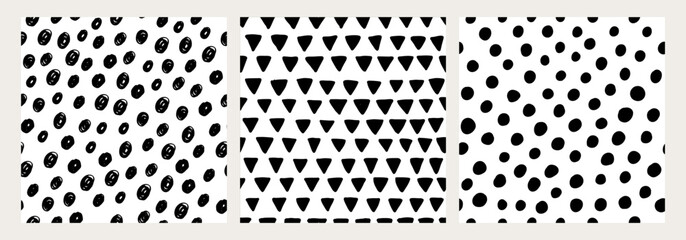 Hand drawn seamless pattern set. Black and white circles and triangles. Minimalist and playful design, perfect for baby textiles, nursery decor, wallpapers, wrapping paper, and creative projects.