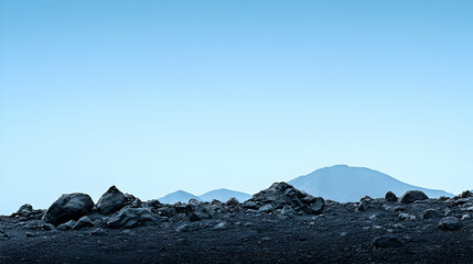 Vast Mountain Range Under Pale Blue Sky