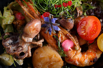 Seafood salad garnished with herbs and edible flowers