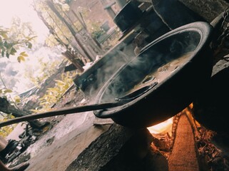 Preparing curry on the traditional fire cooker
Curry making