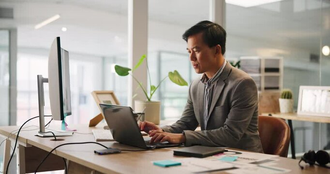 Corporate, typing and Asian man with laptop, office and sales manager with notes for project or review. Reading, employee and person with tech for financial report, online and planning in business