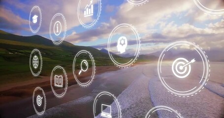 Animation of digital icons overlaying scenic coastal landscape with mountains and ocean - Powered by Adobe
