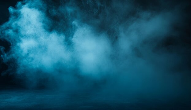 Deep blue smoky haze fills a dark studio