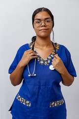 Medical concept of beautiful Brazilian female doctor in white coat with stethoscope, waist up....