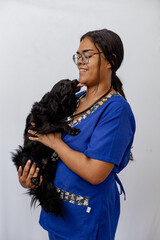 Portrait Of Happy Veterinarian Doctor Woman Holding A black pet, Posing With Healthy Patient Over...